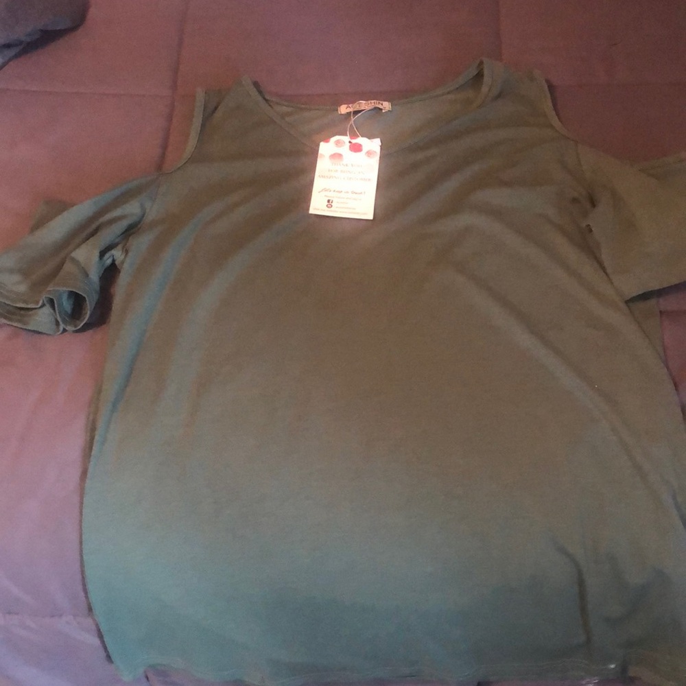 Green knit top.
